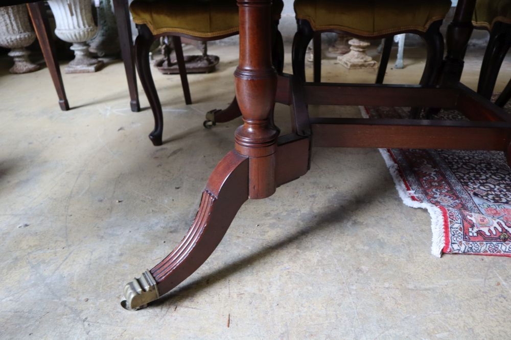 A George III style mahogany drop leaf dining table, 176cm extended width 119cm height 76cm